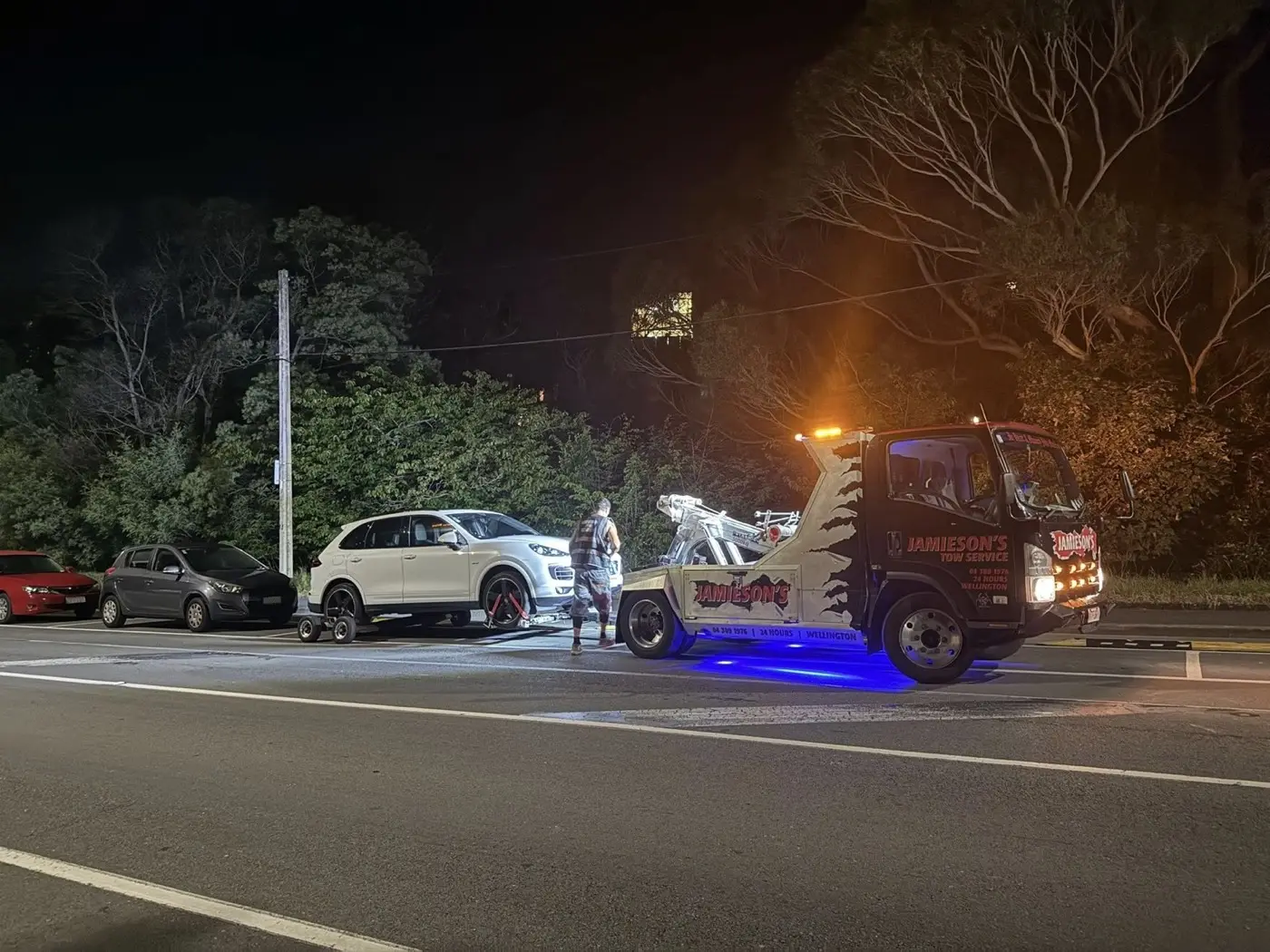 A Jamieson's tow truck at work at night on Brooklyn Road.