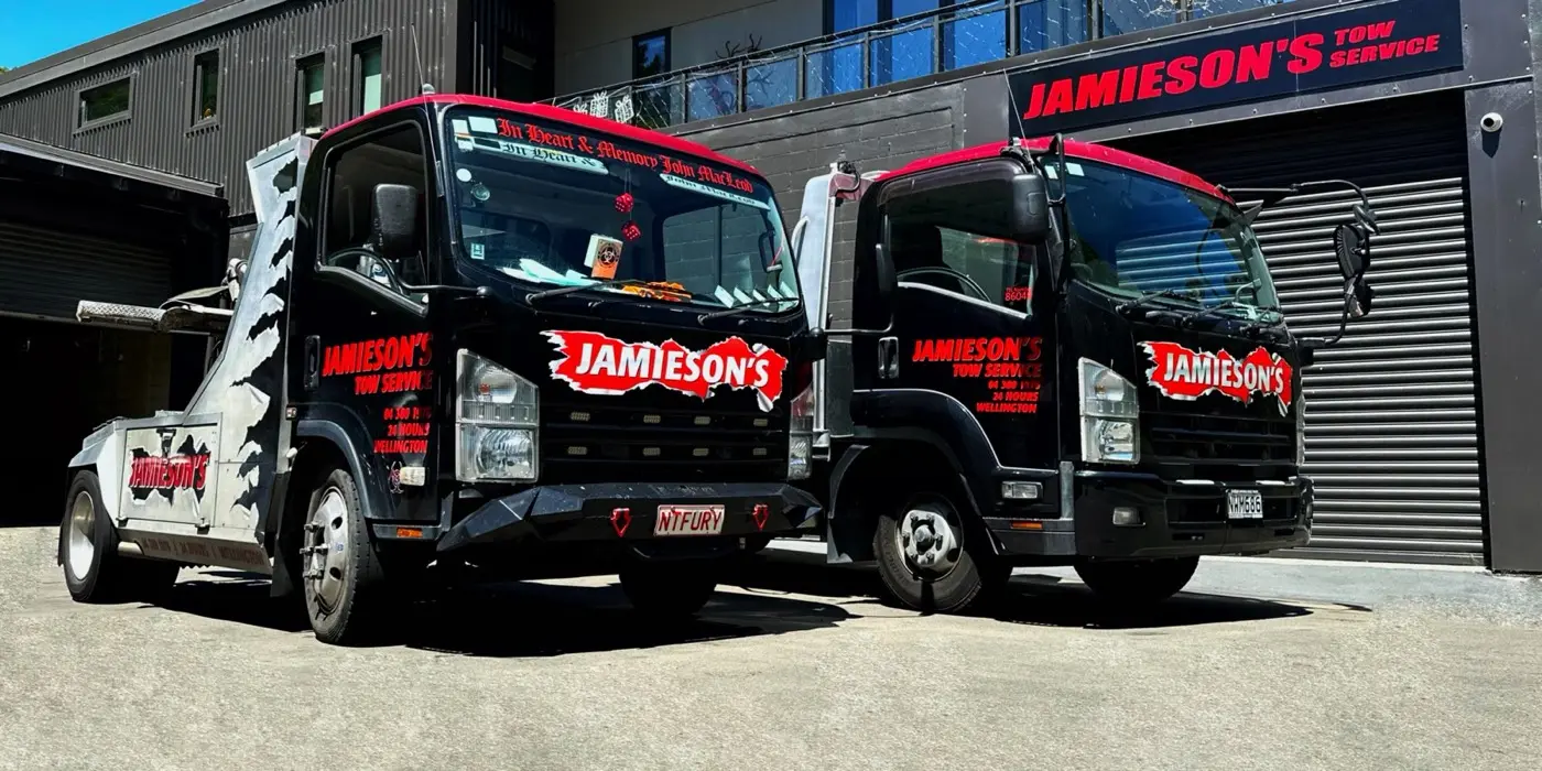 Two Jamieson's tow trucks parked in Jamieson's yard.